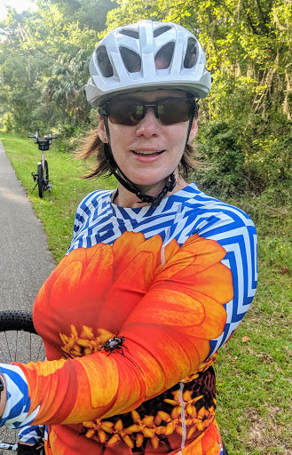 Saving the world one beetle at a time - Marjorie pulled over from her 22 mile bike ride (with her UPF top) to save this beetle- Go Marjorie!