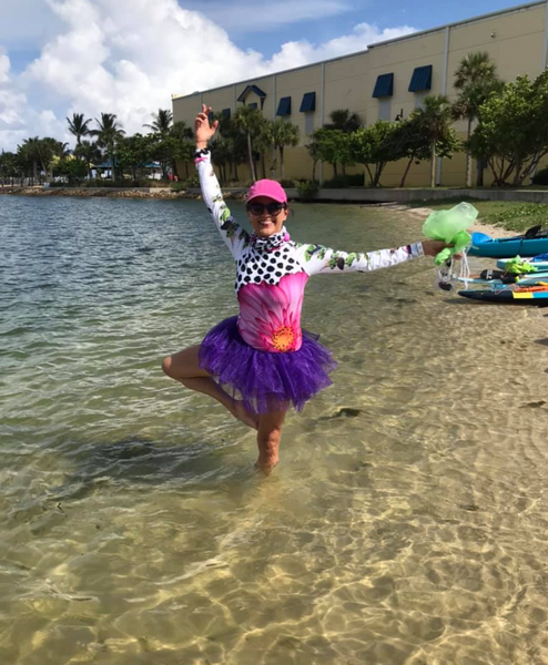 Check out Marcella in her adorable surreal UPF top and purple tutu!